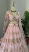 Baby Pink Stunning Double layer Net lehenga With Peplum style blouse