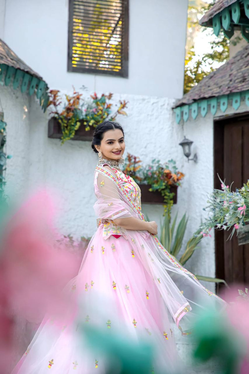 Baby Pink Stunning Double layer Net lehenga With Peplum style blouse