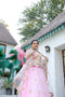 Baby Pink Stunning Double layer Net lehenga With Peplum style blouse